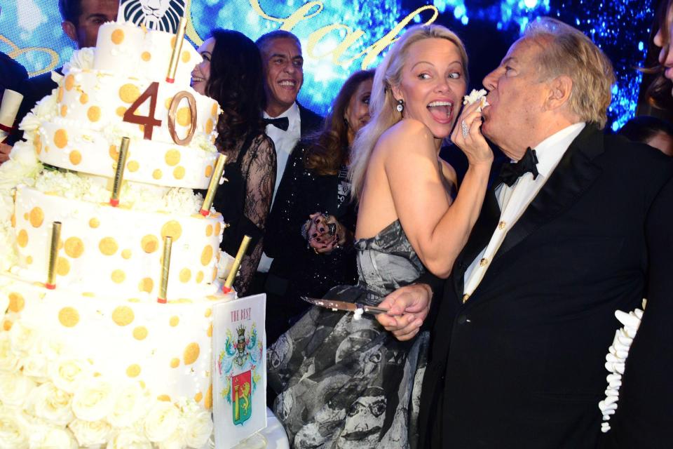  The cheeky star fed Massimo Gargia a bite as they cut the celebratory cake