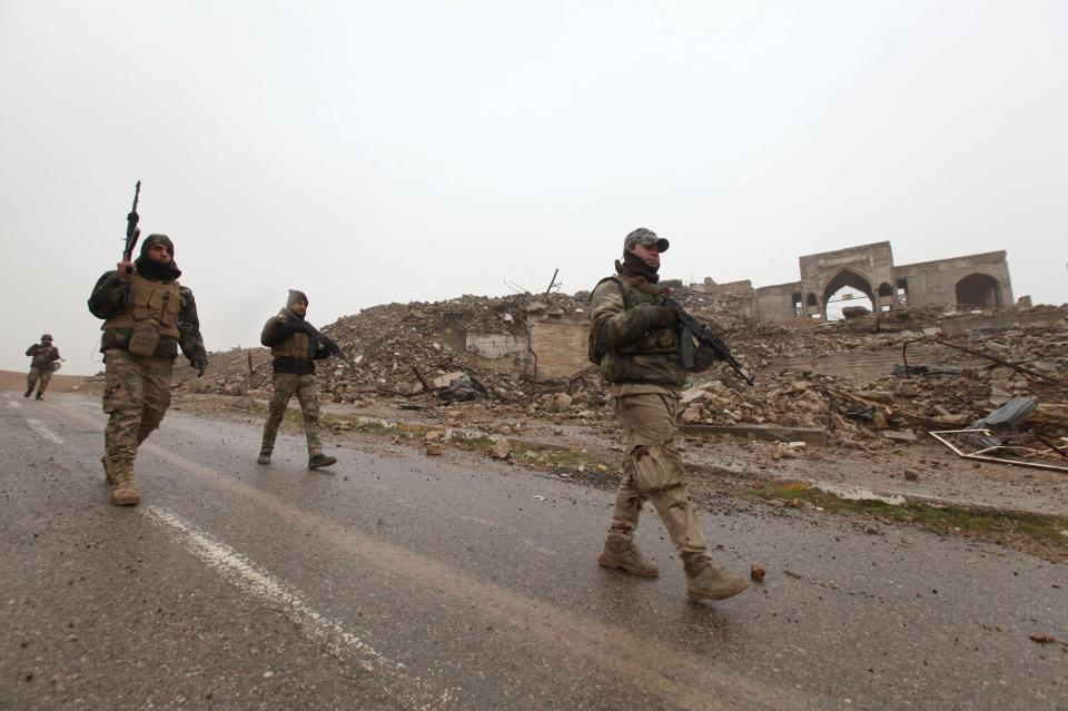  Soldiers inspect the shrine, which was taken on Monday last week along with two other east Mosul neighbourhoods