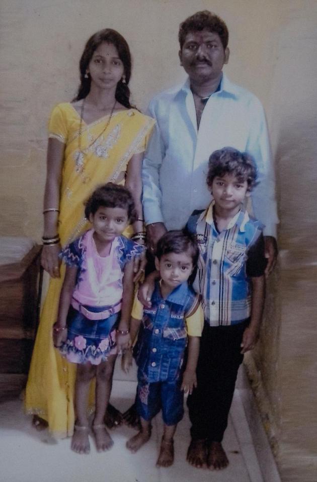 Sunny Pawar, 8, (front right) with his father Dilip Pawar, 32, (back right) mother Vasu Dilip Pawar, 27 (back left), four-year-old brother Jignesh Pawar (front centre) and six-year-old sister Divisha Pawar (front left) in Mumbai, India.