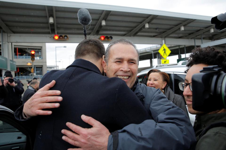 Iraqi immigrant Hameed Darwish is hugged after being released at John F. Kennedy International Airport 