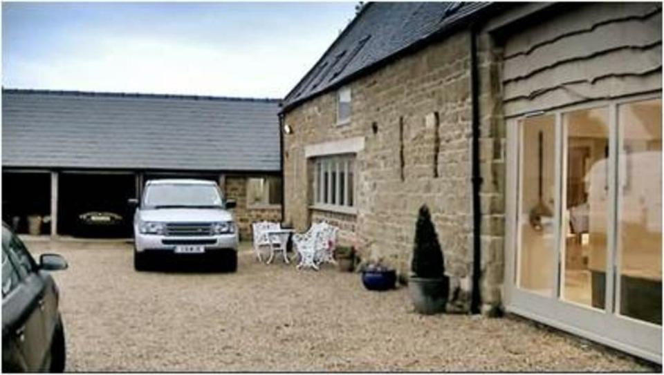  A White Range Rovers sit outside Bancroft's home