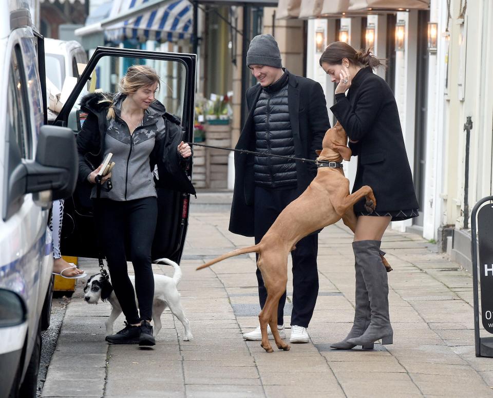  Chris Smalling's dog Ruben leaps up at Bastian Schweinsteiger's wife Ana Ivanovic