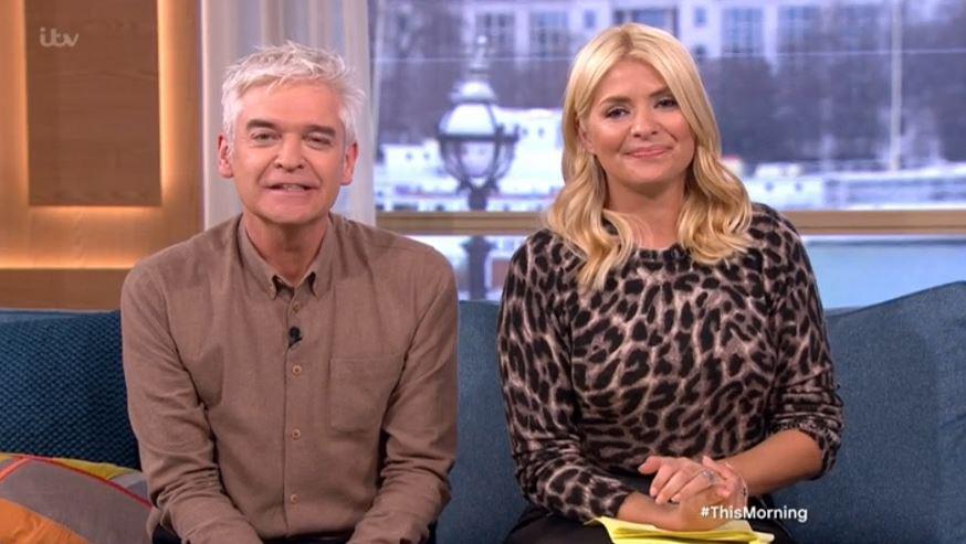  Holly's co-presenter Phil will have to make room on the sofa for her cats