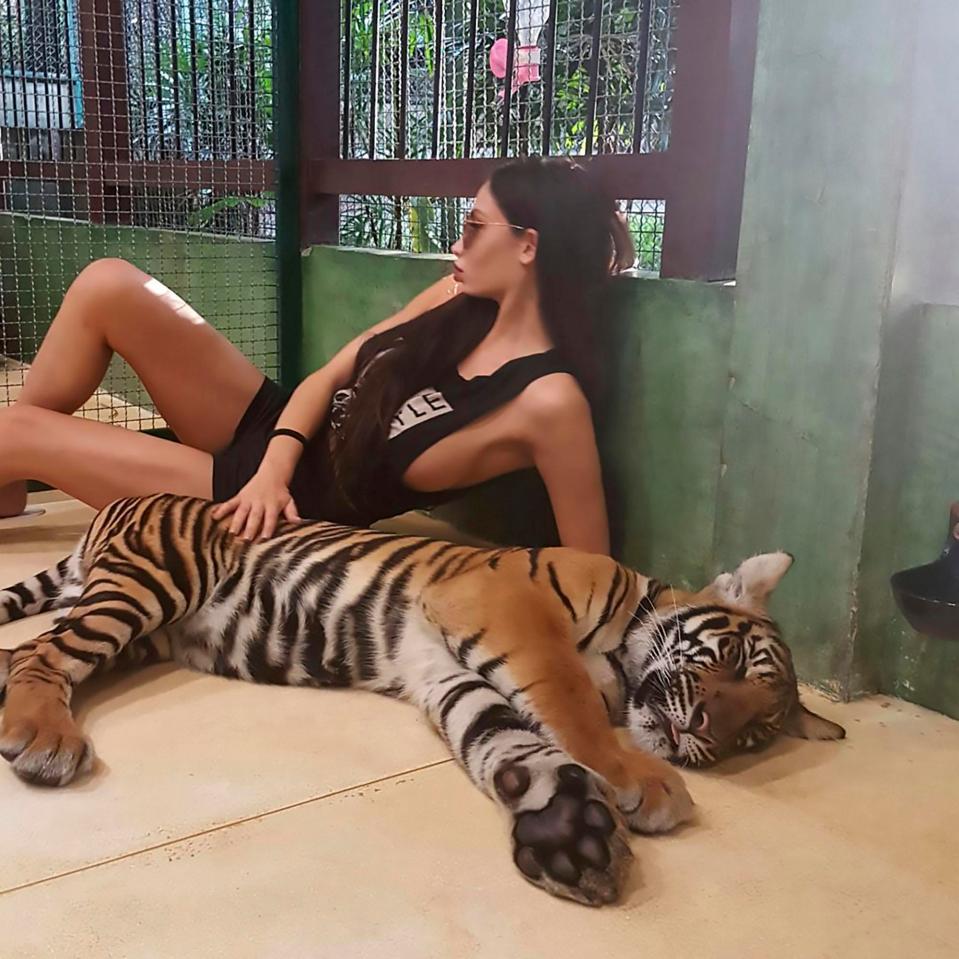  Soraja Vucelic shows off her wild side by posing with a tiger