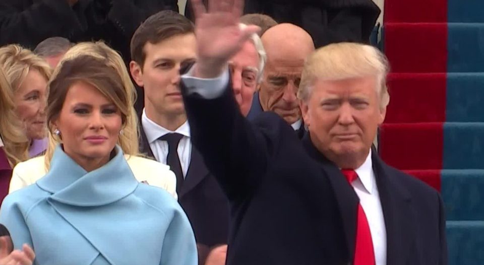  Trump waved to the crowd with Melania by his side