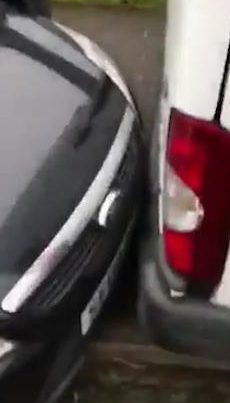  Video footage shows the car parked millimetres from the back of the van