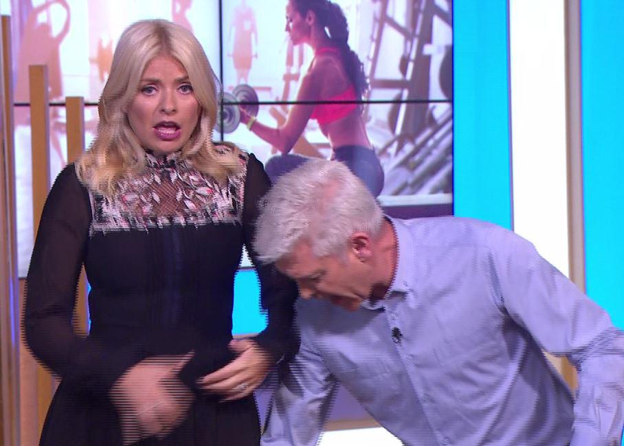  Holly looked terrified as Phil pranked her about the mouse