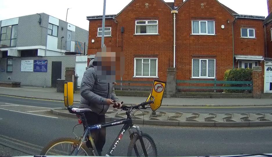  The unknown man is seen taking a picture of the car