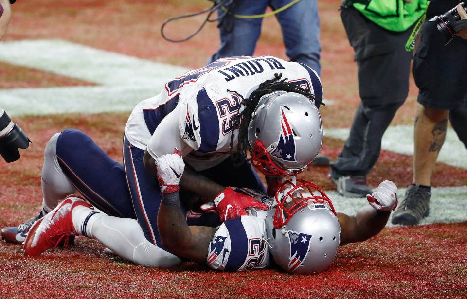  James White is mobbed after his game-winning touchdown