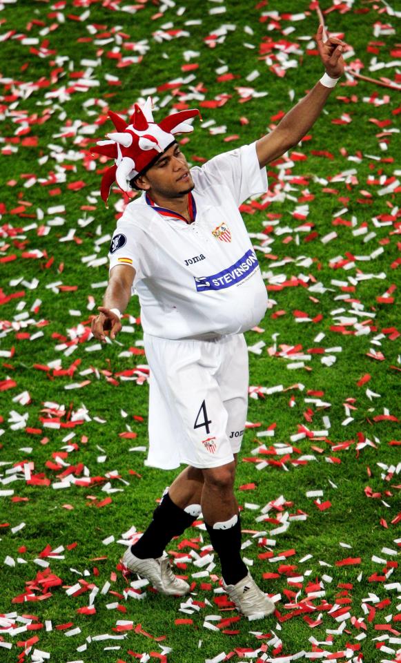 Dani Alves celebrates winning Europa League with Sevilla against Middlesbrough