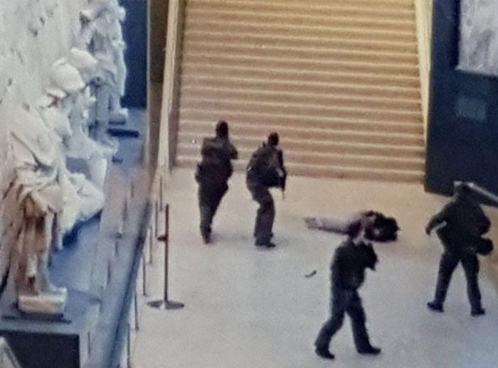  The terror suspect lies wounded on the ground after being shot when he attacked four soldiers