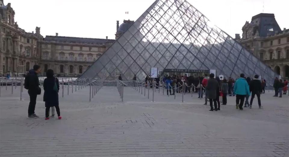  A French soldier is thought to have opened fire at a knifeman trying to enter the Louvre with a suitcase