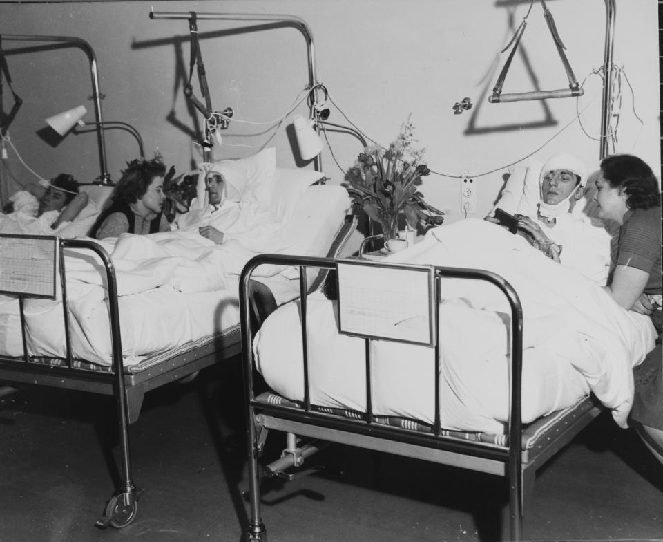  An injured Dennis Viollet talks to his wife from his hospital bed in Munich