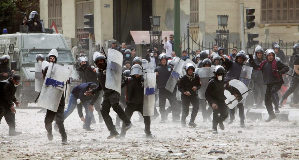  Riot police charge towards protesters the following day