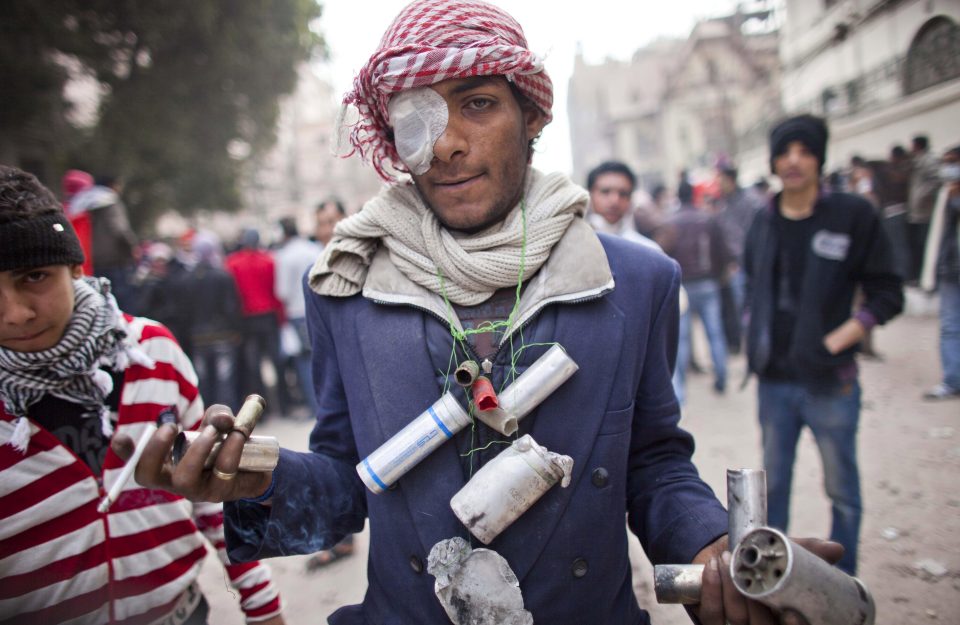  A protester shows the tear gas cartridges used by police