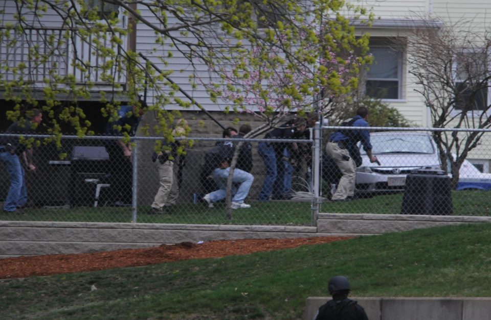  Cops approach the scene of the shoot-out on the street in Watertown, Massachusetts