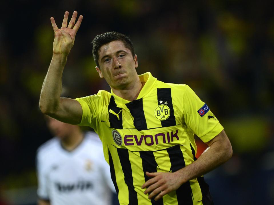 Robert Lewandowski holds aloft four fingers after awesome showing