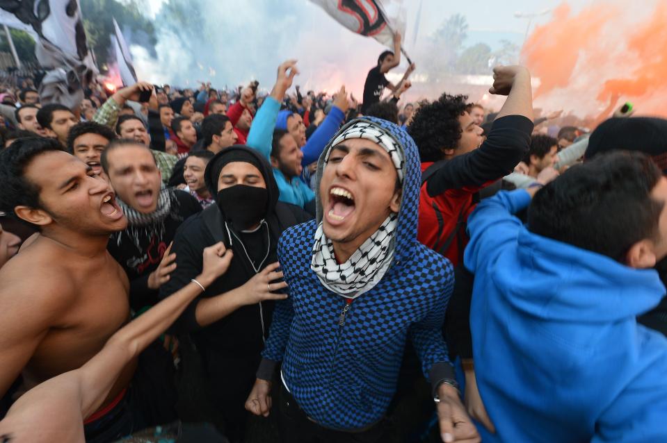  Al-Ahly fans celebrate after the original sentencing in 2013