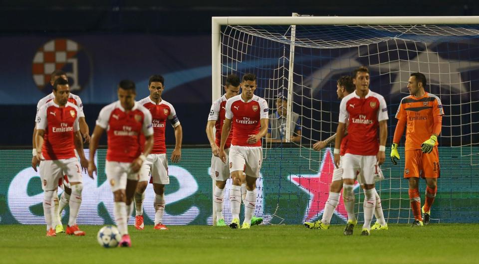 Arsenal players wear a look of dismay as they lose to lowly Dinamo Zagreb