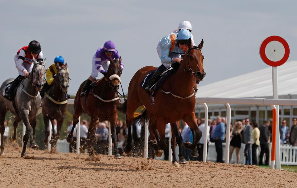 Tawdeea and jockey Sam James (right) wins the a Handicap at Newcastle Racecourse