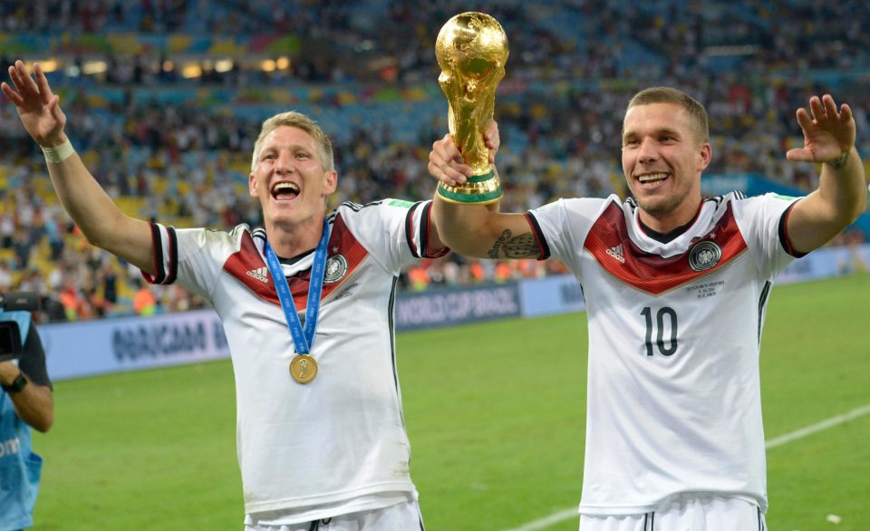 Podolski sharing 2014 World Cup glory with BPodolski sharing 2014 World Cup glory with Bastian Schweinsteiger astian Schweinsteiger