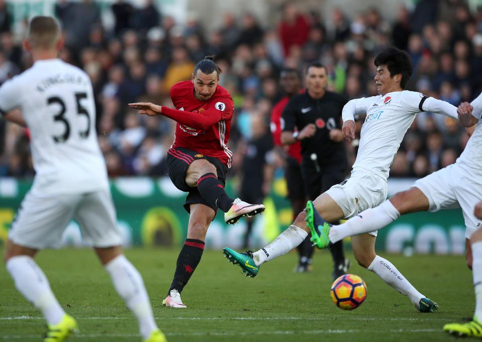  Ibra fires off an effort against Swansea in October wearing Nike boots