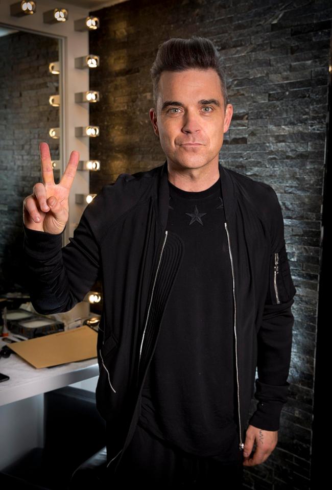  Robbie Williams is on board for the reunion with his band mates