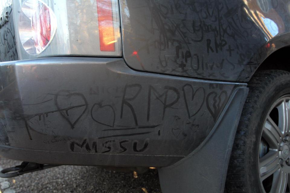 Fans wrote messages in the dirt on the car saying 'RIP George'