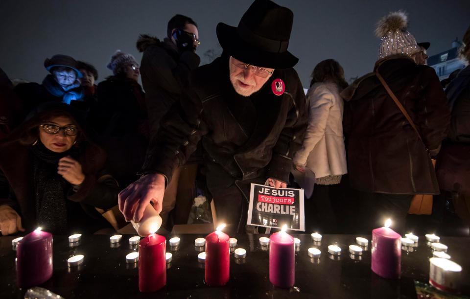  Two years on from the attack Parisians lit candles at the monument on Place de la Republique