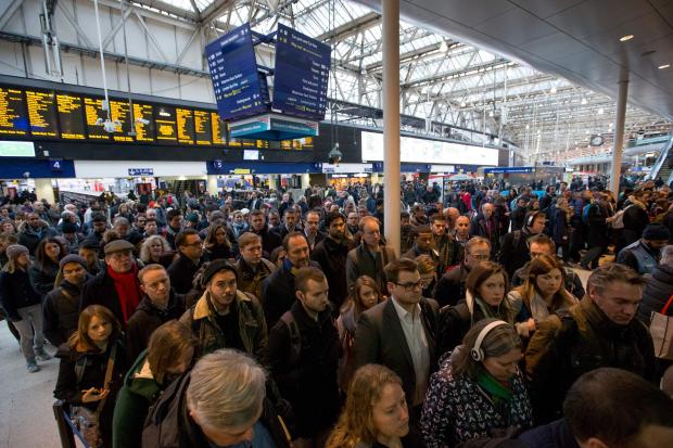 Commuters at London Waterloo station after strike action by Southern Rail caused another morning of travel disruption