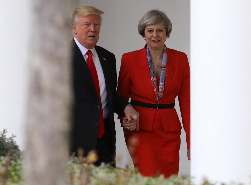  Mrs May was seen holding Donald Trumps hand in Washington