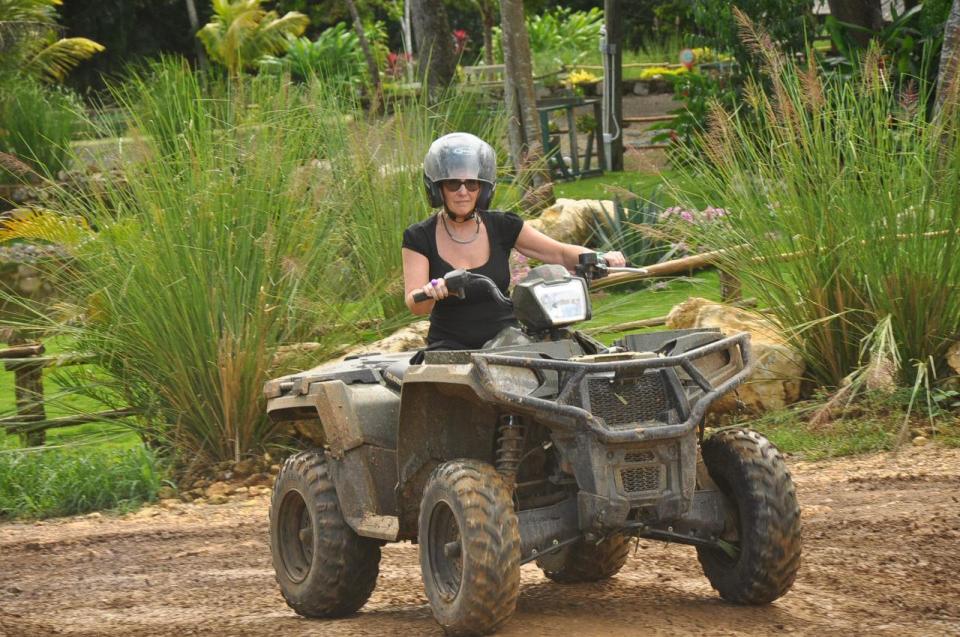  Lisa on a quad bike during her trip