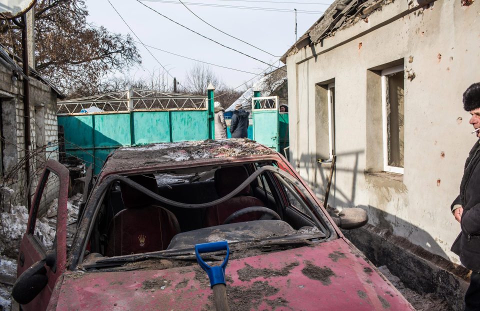  A car destroyed when a Grad rocket, one of many that hit the same part of town, fell