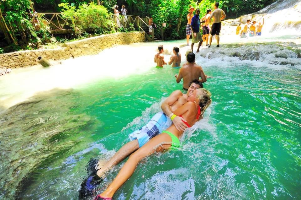  While the sensible would just admire the view, many climb up the falls, slipping, sliding and soaking each other on the way