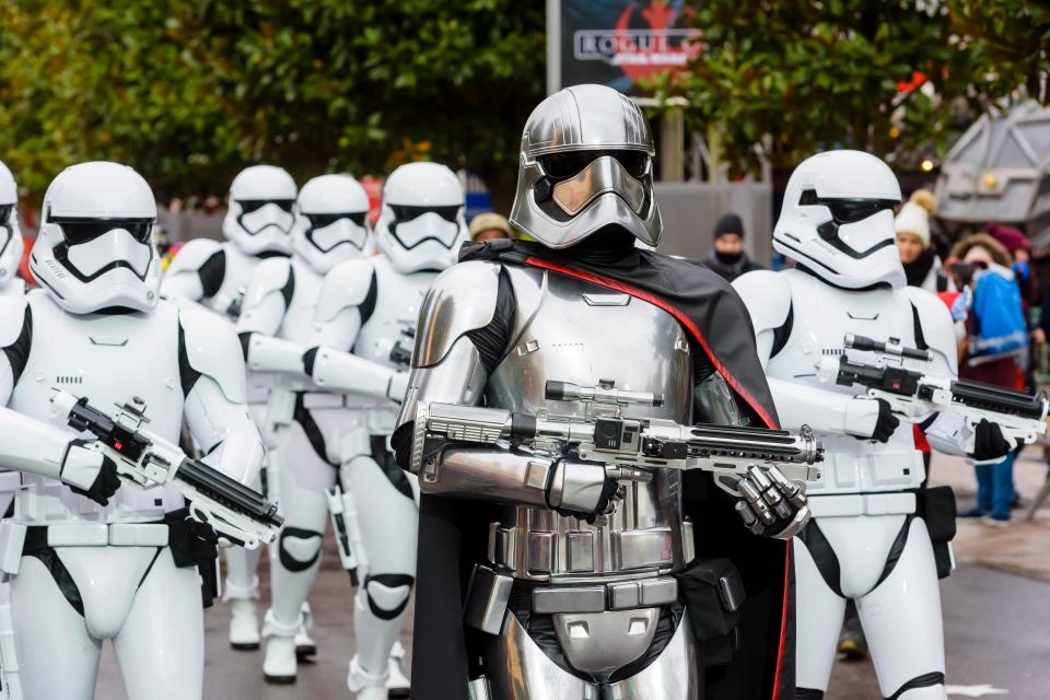  The procession of First Order Stormtroopers carrying blaster rifles betrays a tangible air of menace