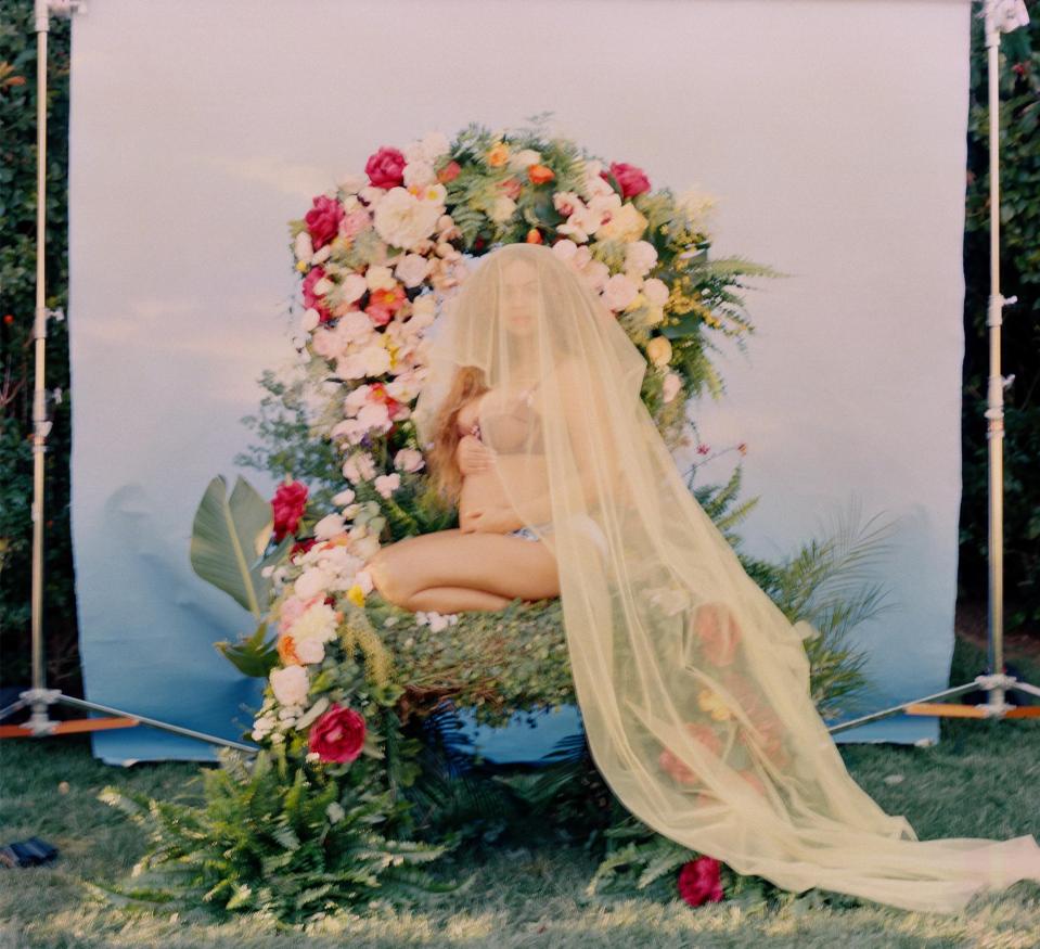  Beyonce sat in a throne of flowers while showing the full length of her veil