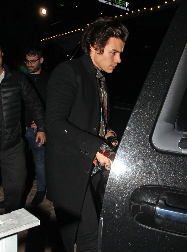  Harry looked a tad bleary eyed as he left the party