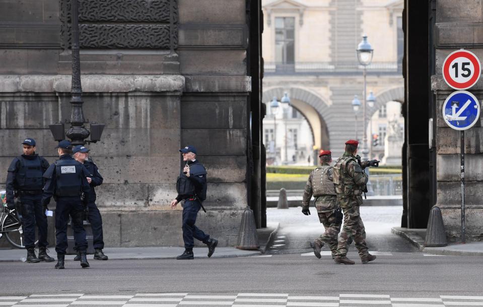  Armed police swooped on the Louvre after a soldier reportedly opened fire on a knifeman with a suitcase