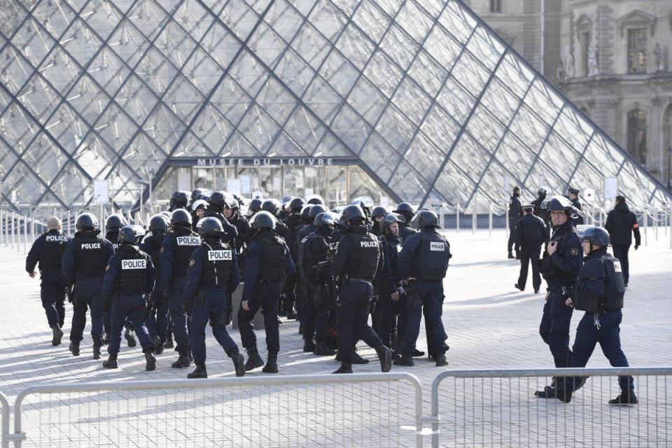  Dozens of police surrounded the gallery in central Paris this morning