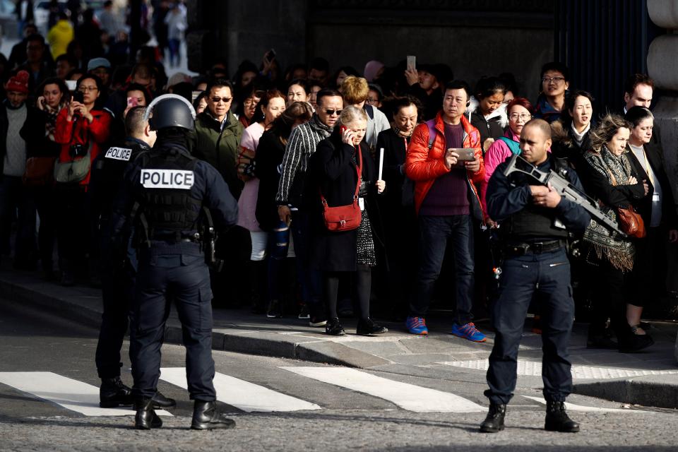  Tourists were shepherded out by heavily-armed police as authorities began to evacuate the gallery