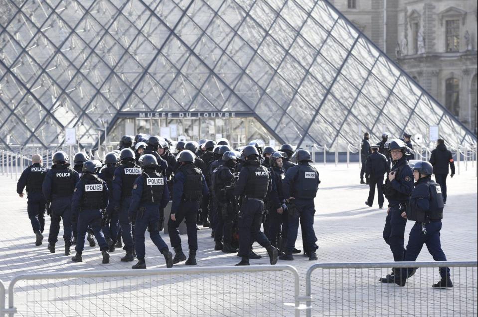  Armed police at the Louvre in Paris where a machete-wielding attacker was shot