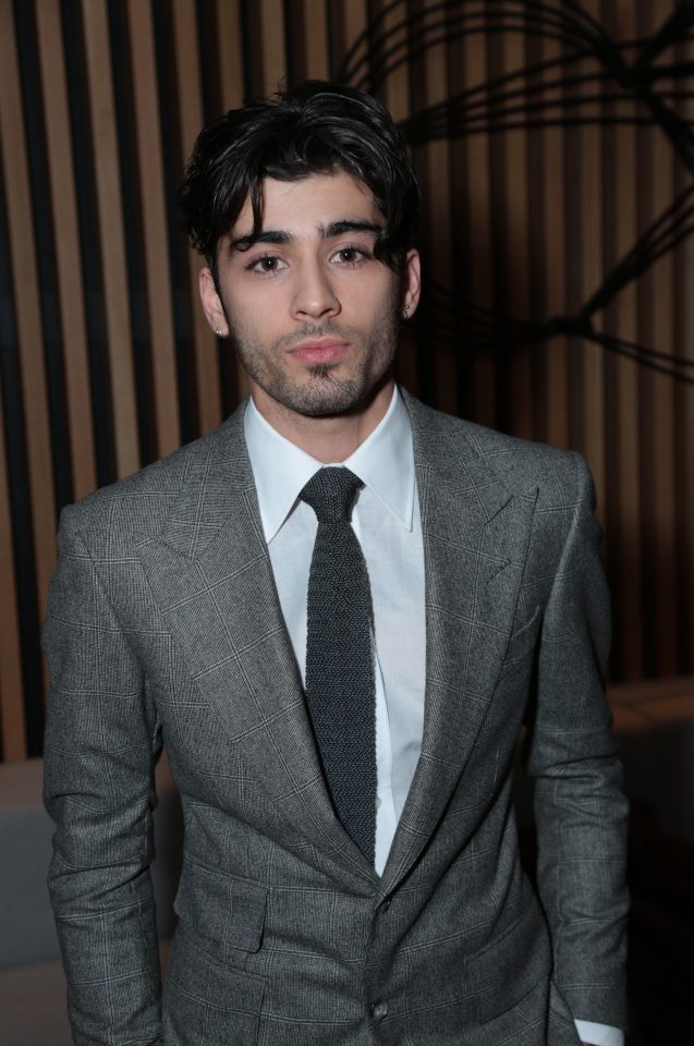  The former One Direction star looked chic in a grey suit