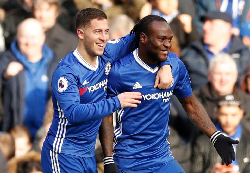  He is congratulated by Victor Moses after jinxing his way through Arsenal to score