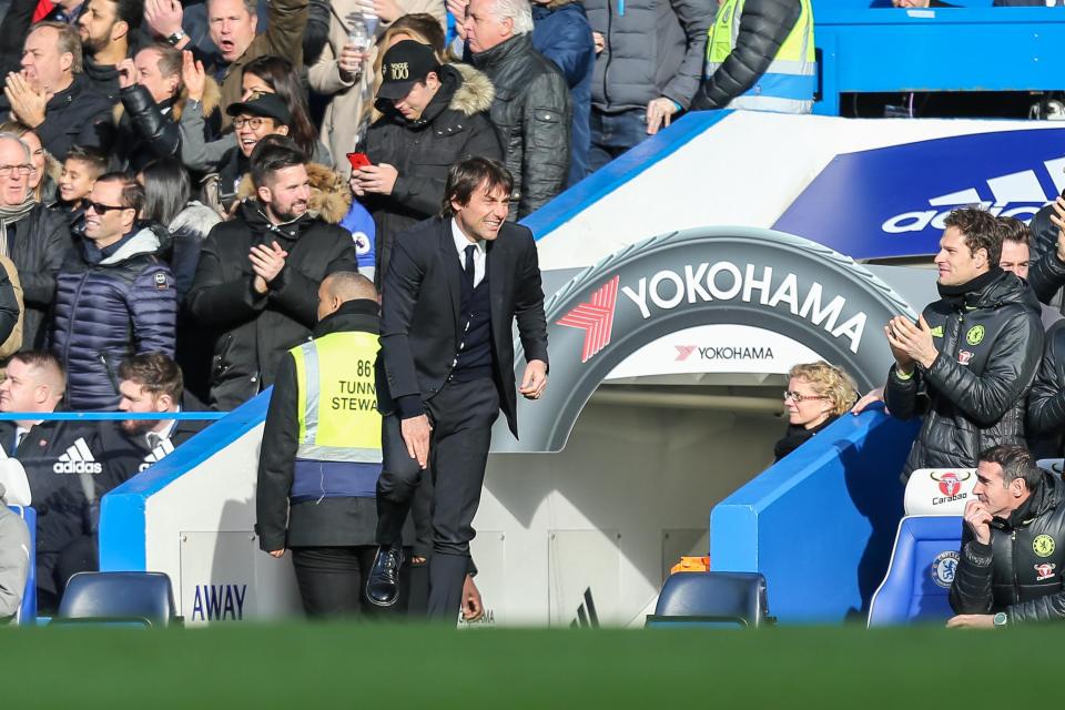  Antonio Conte looked to be in pain after his manic celebration