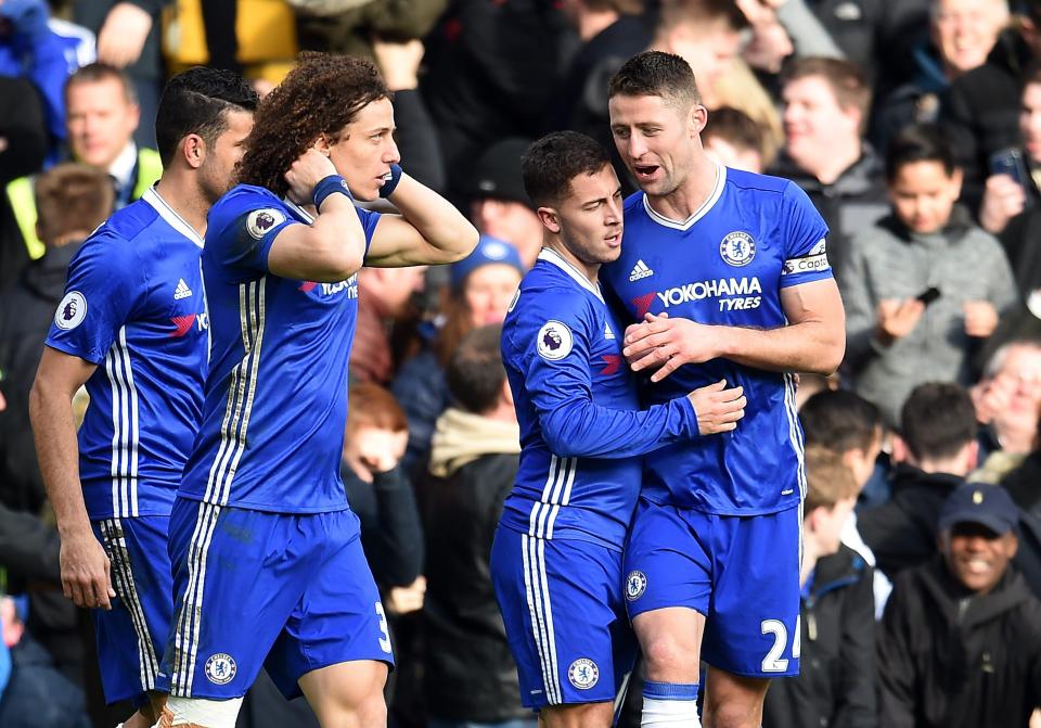  Hazard is mobbed by his team-mates after scoring an exquisite goal