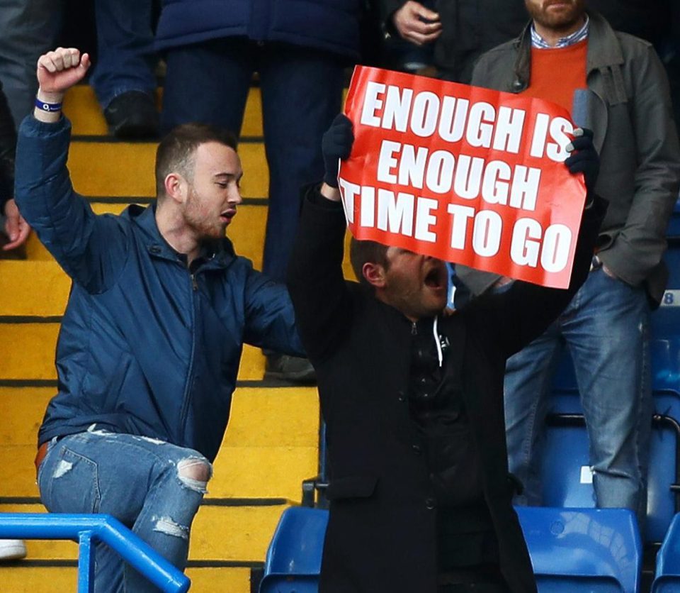 One Arsenal fan showed a Wenger-out sign during the 3-1 defeat to Chelsea