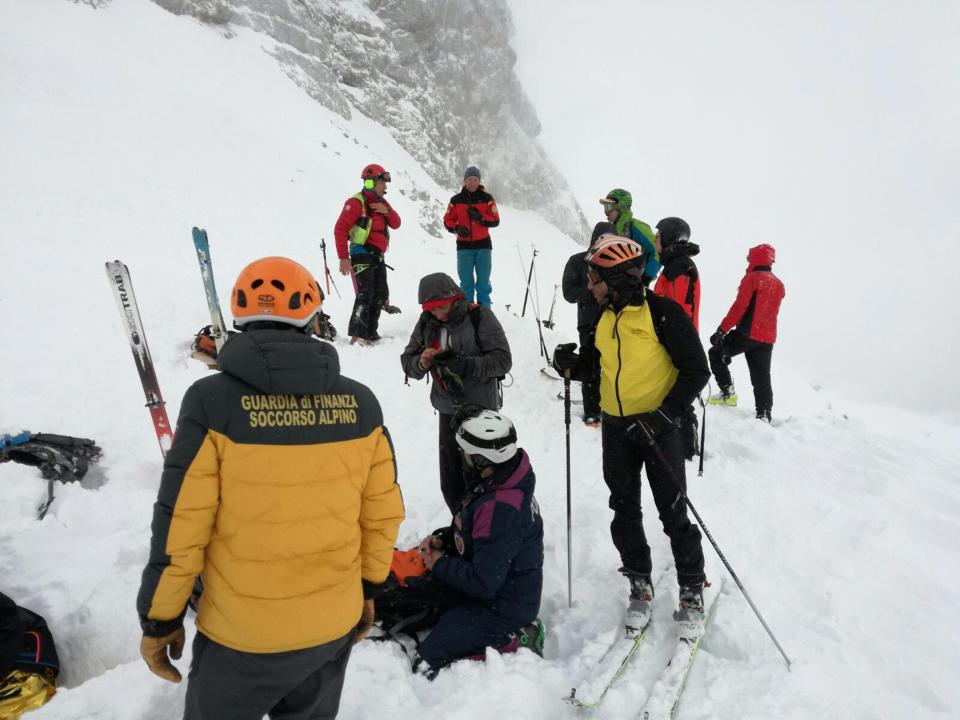  Rescuers photographed during the operation to find seven missing skiers on Saturday