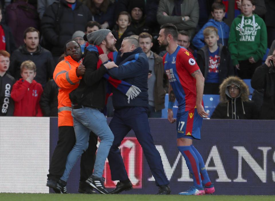 Security attempted to restrain the fan as he charged towards Delaney