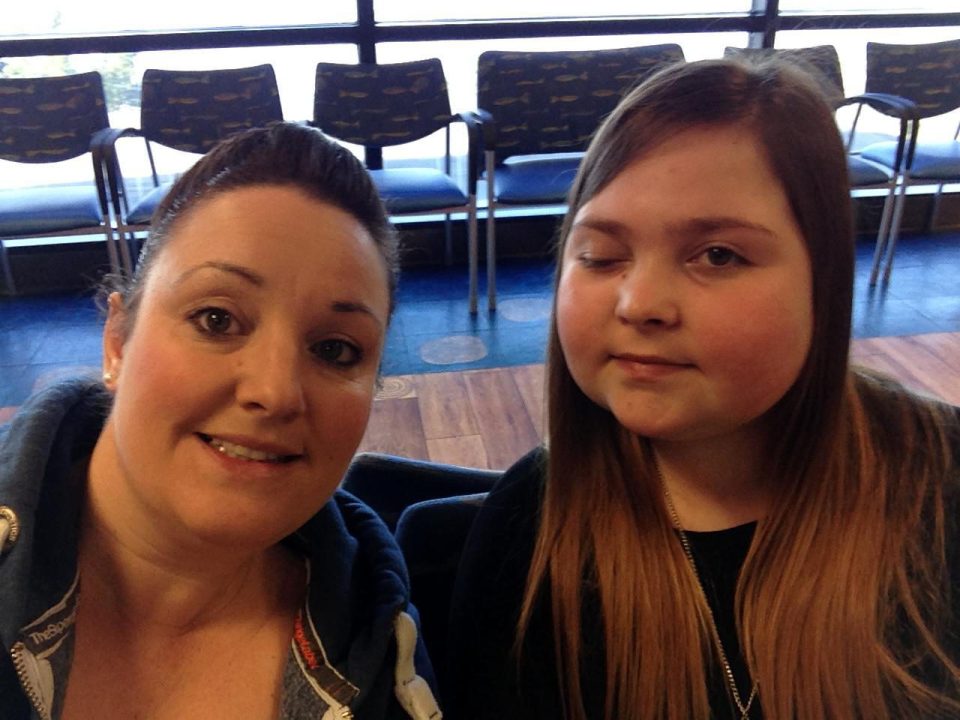 Lily pictured with her mum Kate after surgery which caused her eye to temporarily close due to nerve damage during surgery