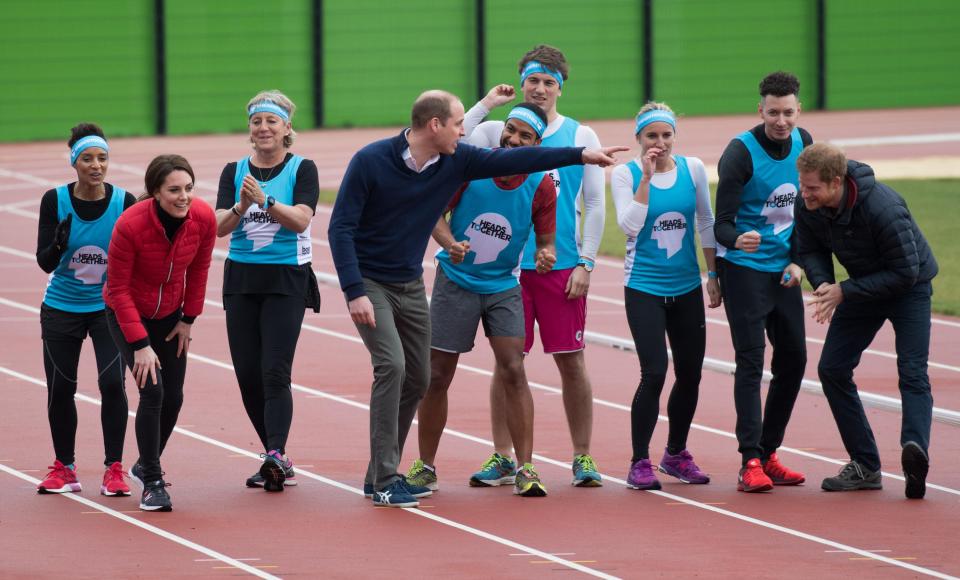  Prince William points a knowing finger in the direction of his younger brother at the start line